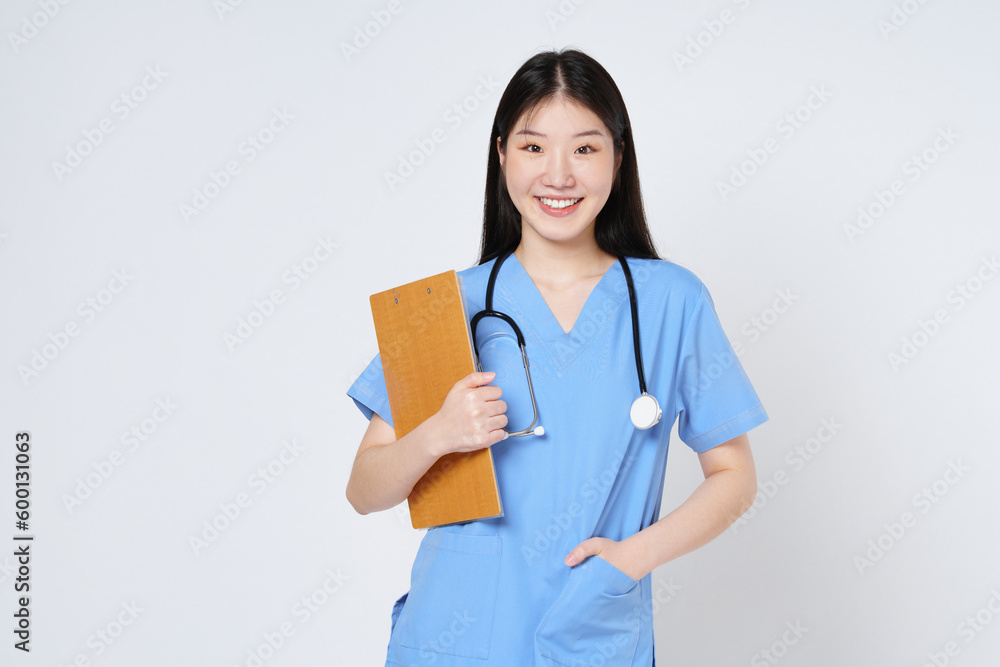 Smiling woman doctor holding clipboard and stethoscope isolated on white background. Smiling woman doctor holding clipboard and stethoscope isolated on white background.