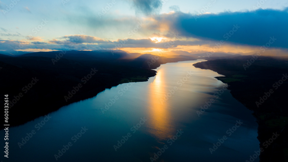 Fototapeta premium sunset over the lake. The setting sun over the lake as the evening sun sets. wonderful sky