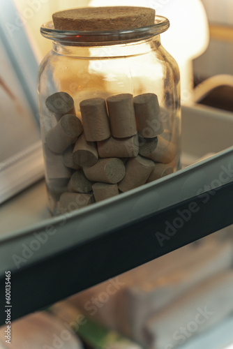 Moxibustion treatment: Traditional Chinese medicine tools for heating acupuncture point therapy. chinese herbal medicine Copper moxibustion burner box with herbal moxa sticks in holistic clinic.