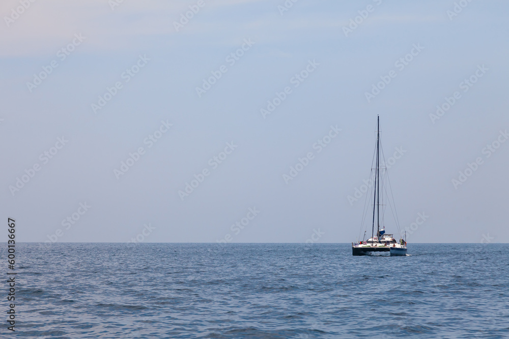 A yacht with masts in the Andaman Sea for traveling with family and friends. Voyage while on vacation in hot countries.