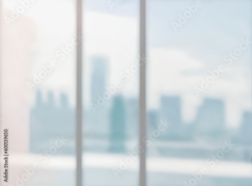 Blurred abstract glass wall from building in city town background. © birdmanphoto