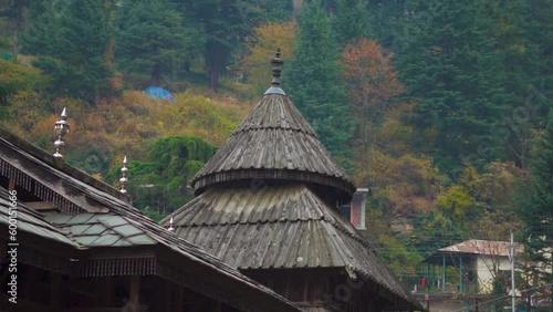 View of the Tripura Sundari Temple near Naggar Castle at Naggar in Himachal Pradesh, India. Ancient Temple made from wood with delicate carvings. Pagoda Style temple near Manali. photo