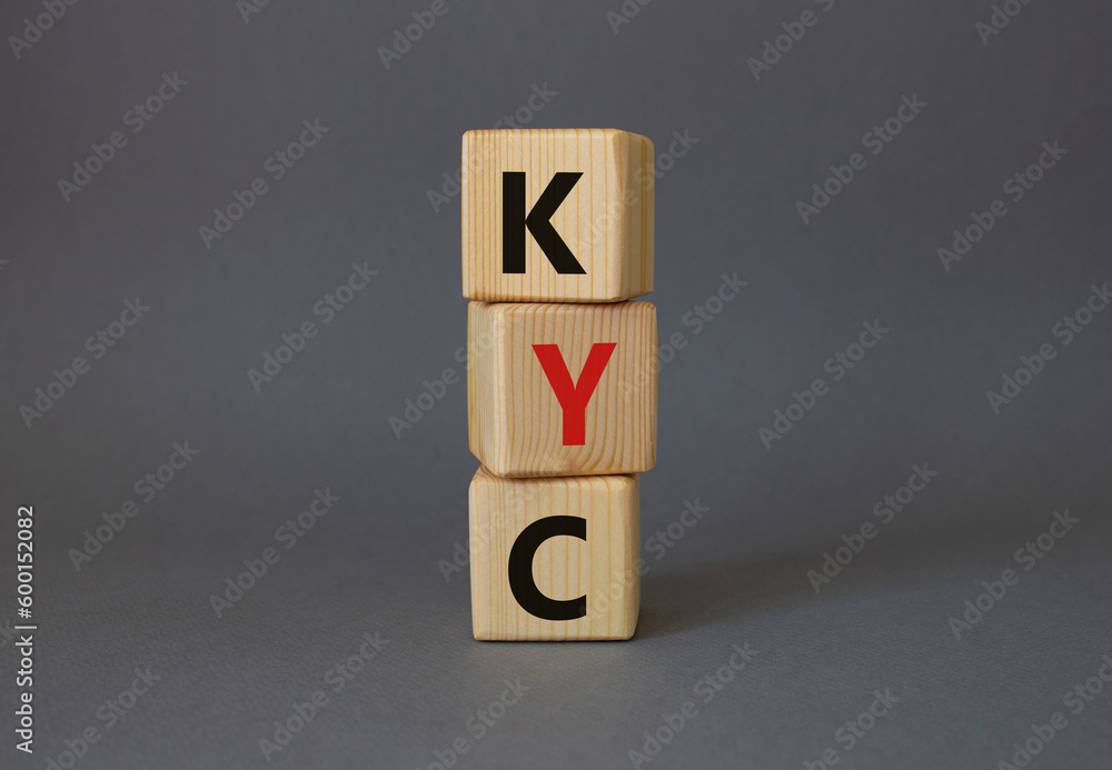KYC - Know Your Customer. Wooden cubes with word KYC. Beautiful grey background. Business and Know Your Customer concept. Copy space. KYC - Know Your Customer. Wooden cubes with word KYC. Beautiful grey background. Business and Know Your Customer concept. Copy space.