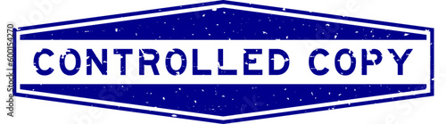 Grunge blue controlled copy word hexagon rubber seal stamp on white background