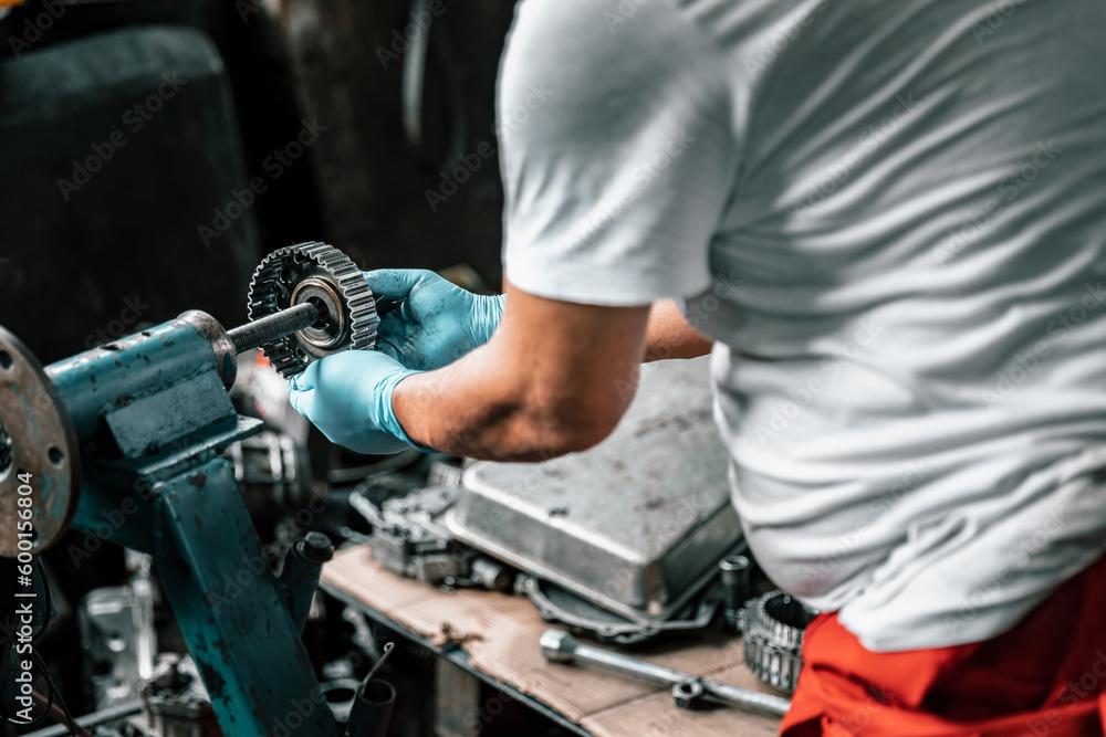 Auto mechanic diagnose and troubleshoots with tools and equipment. Polishing car, fixing braking and steering systems. Measuring oil levels with oil gauge stick and then pouring or changing it. Auto mechanic diagnose and troubleshoots with tools and equipment. Polishing car, fixing braking and steering systems. Measuring oil levels with oil gauge stick and then pouring or changing it.
