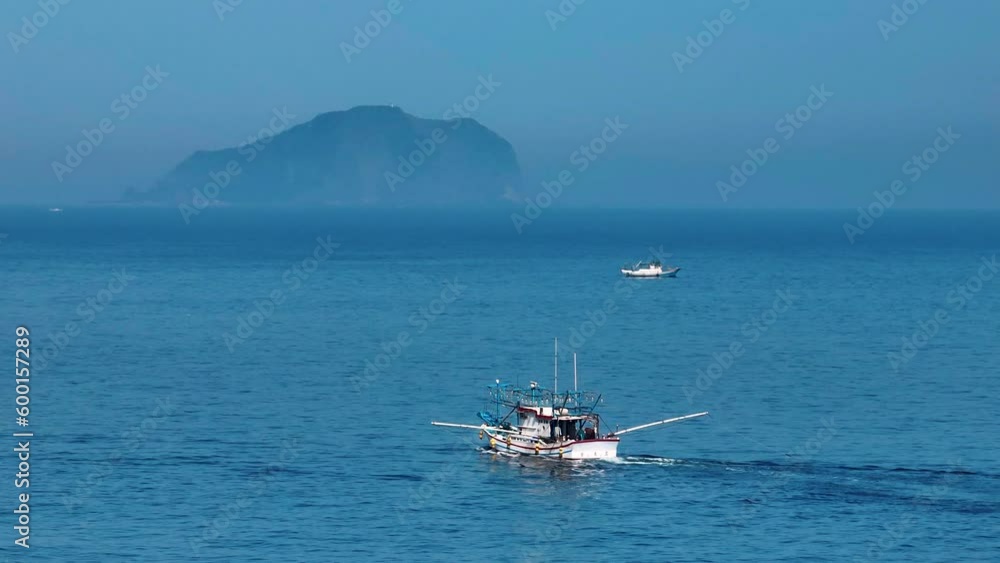 aerial view of fishing boat working on the sea
aerial view of fishing boat working on the sea