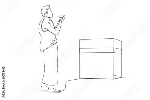 A pilgrim prays to facing the Kaaba. Hajj pilgrims one-line drawing