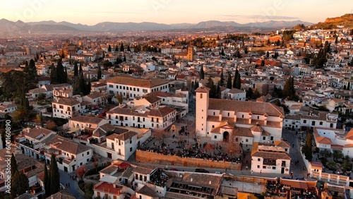 Aerial view of Granada city, Albaicin district at sunset, old Moorish quarter of the city, located on a hill facing the Alhambra. Andalusia, Spain © Vgallery