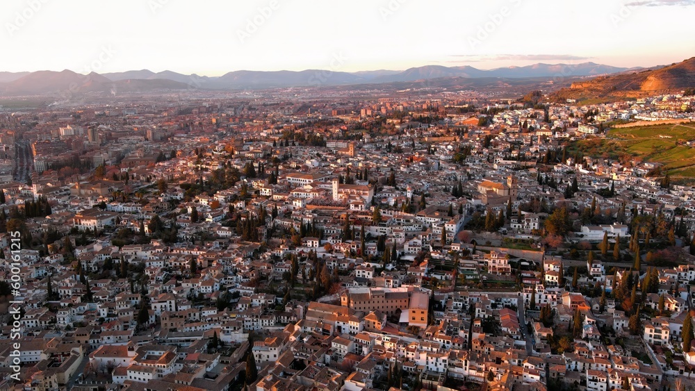 Aerial view of Granada city, Albaicin district at sunset, old Moorish quarter of the city, located on a hill facing the Alhambra. Andalusia, Spain