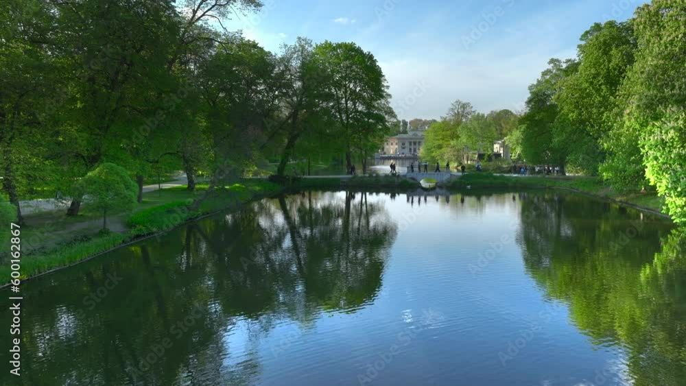 Aerial view of Lazienki Park in Warsaw, Poland on a sunny afternoon.
Royal Palace on the Isle - known as Baths Palace - divides the lake into two parts, a smaller northern lake and a larger southern. Aerial view of Lazienki Park in Warsaw, Poland on a sunny afternoon.
Royal Palace on the Isle - known as Baths Palace - divides the lake into two parts, a smaller northern lake and a larger southern.