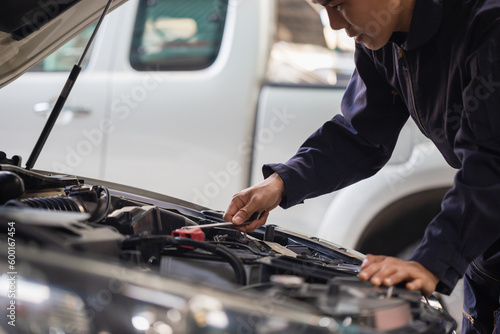 Car mechanic in repair garage, Technician man working in auto repair shop, Car repair and maintenance concepts