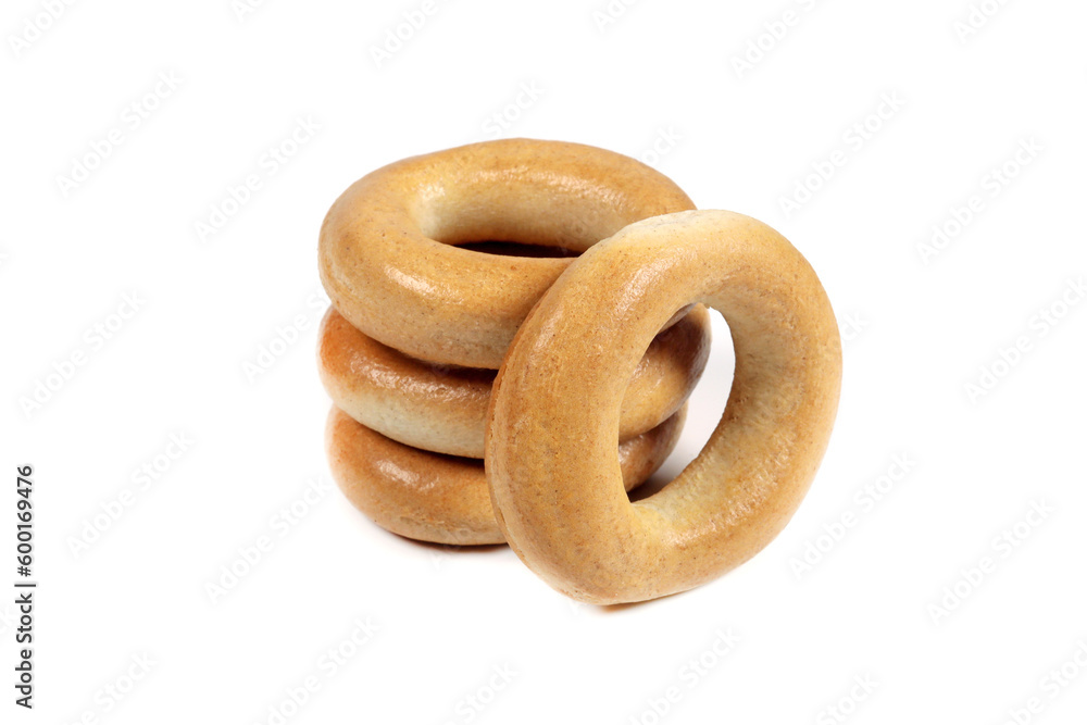 Delicious dry bagels isolated on white