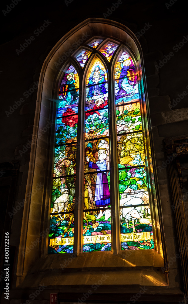 Ancient Glass Window In Church Notre-Dame De La Tronchaye In Picturesque Village Rochefort En Terre In The Department Of Morbihan In Brittany, France