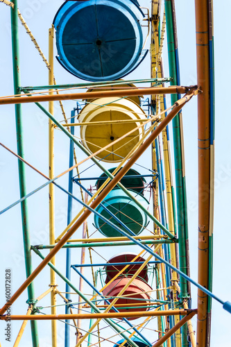 colorful ferris wheel on the background of the blue sky