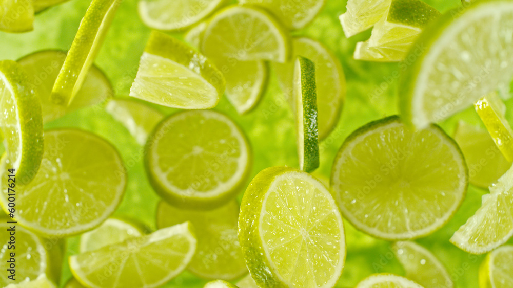 Top shot of lime slices flying up in the air. Top shot of lime slices flying up in the air.
