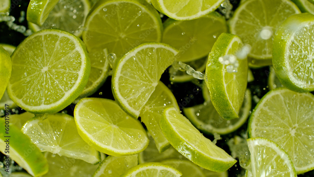 Top shot of lime slices flying up in the air. Top shot of lime slices flying up in the air.