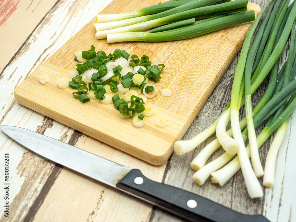 top view of green onion cut on a cutting board