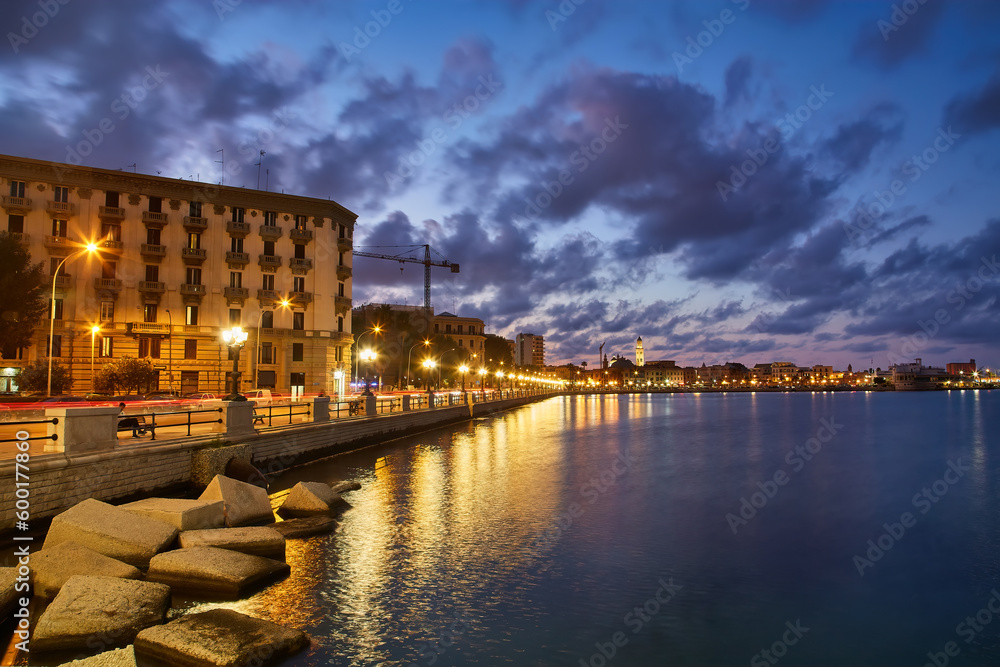view of Bari, Southern Italy, the region of Puglia, Apulia seafront at dusk. Basilica San Nicola in the background.