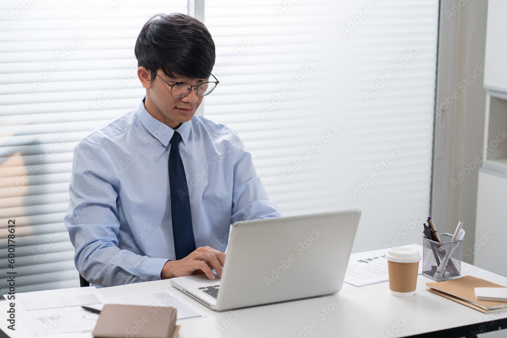 Business man working by using laptop computer Hands typing on a keyboard. Professional investor working new start up project. business planning in office. Technology business Business man working by using laptop computer Hands typing on a keyboard. Professional investor working new start up project. business planning in office. Technology business