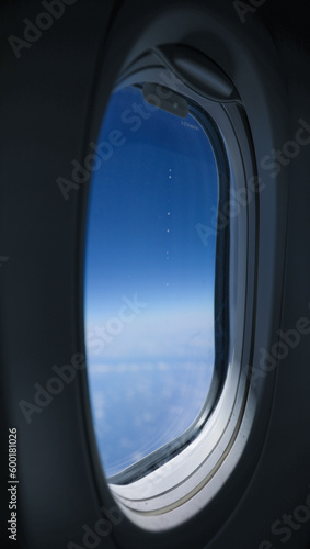 airplane window view symbolizes the wonder and excitement of travel  the vastness and beauty of the world  and the thrill of exploring new places and perspectives. It inspires a sense of adventure 