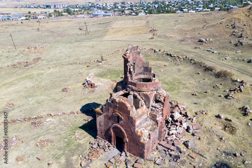 Aerial view of ruins of Arakelots Monastery and Pemzashen village on sunny summer day. Shirak Province, Armenia.
