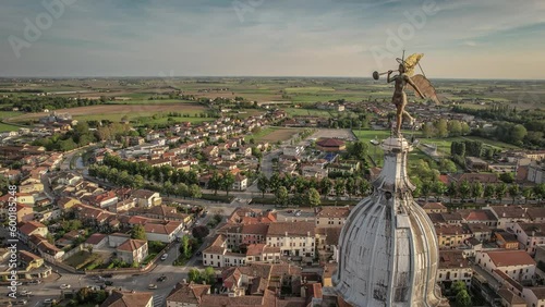 Aerial Panorama of Lendinara's Santa Sofia Bell Tower Angel Statue at Sunset photo