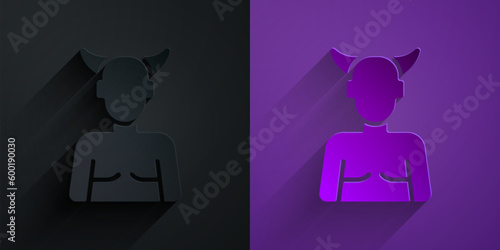 Paper cut Krampus, heck icon isolated on black on purple background. Horned devil. Traditional Christmas devil. Happy Halloween party. Paper art style. Vector