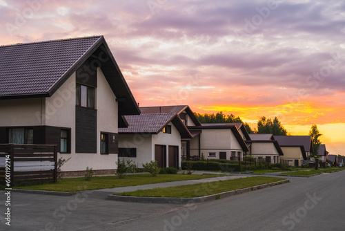 Fototapeta Naklejka Na Ścianę i Meble -  Village houses at sunset in summer. Beautiful view
