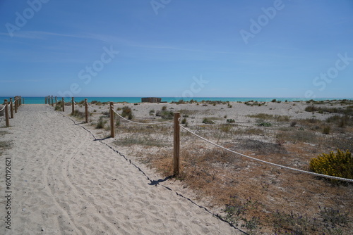 Path to the Mediterranean beach with sunshine and sky