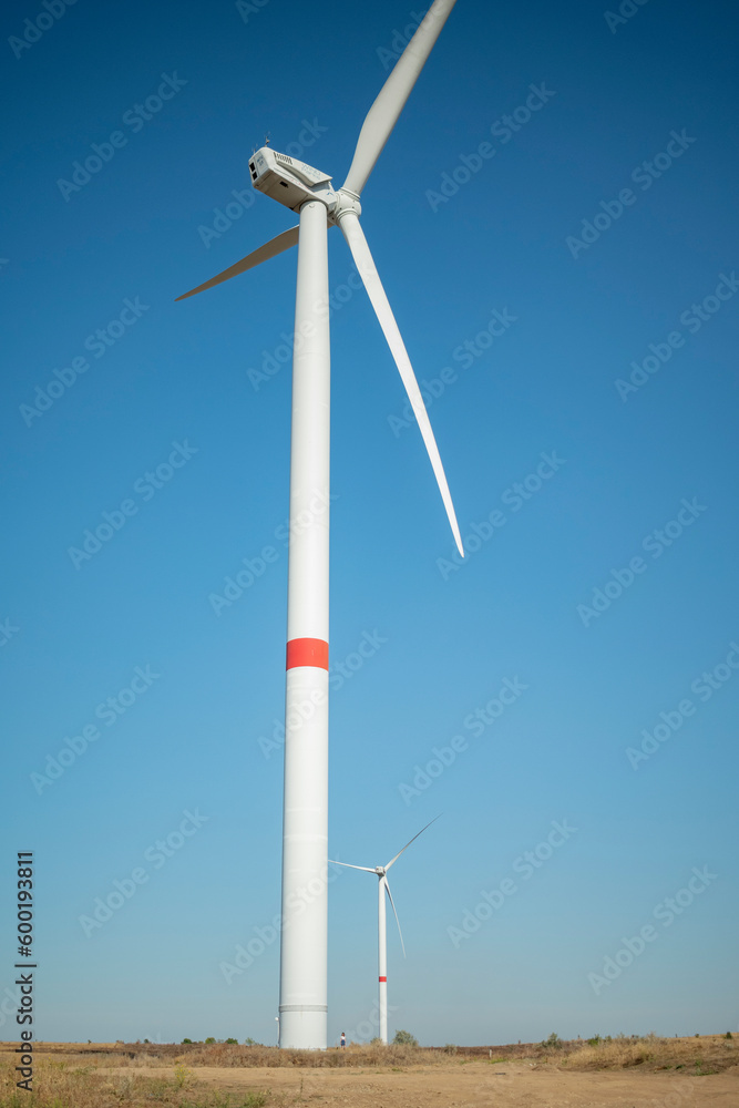 Wind turbine against a clear blue sky Wind turbine against a clear blue sky