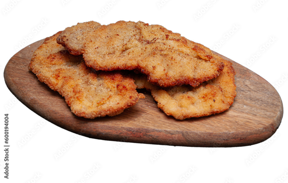 Pork chop pile on a wooden board. Isolated