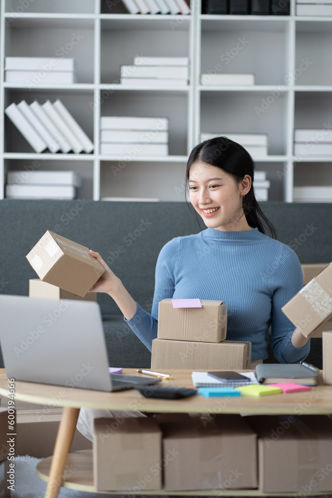 Young SME business owner promoting her store online, getting customer engagement. Young SME business owner promoting her store online, getting customer engagement.
