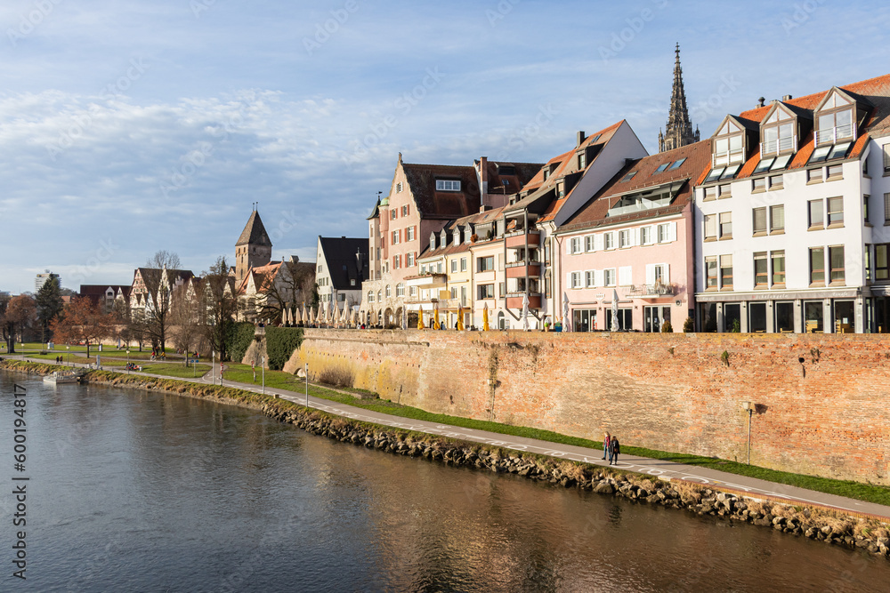 Fototapeta premium Beautiful old wooden beam houses with white and orange plaster. Fishermen's Quarter. Ulmer Stadtmauer. Fachwerk. Danube River Embankment