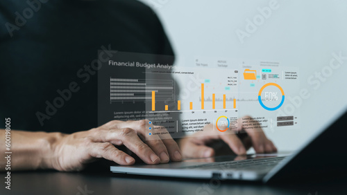 Analyst computer working with information database to analysis marketing sale data. Business project or program strategy planning and development for corporate operating finance and investment concept