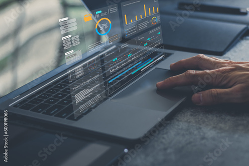 Analyst computer working with information database to analysis marketing sale data. Business project or program strategy planning and development for corporate operating finance and investment concept