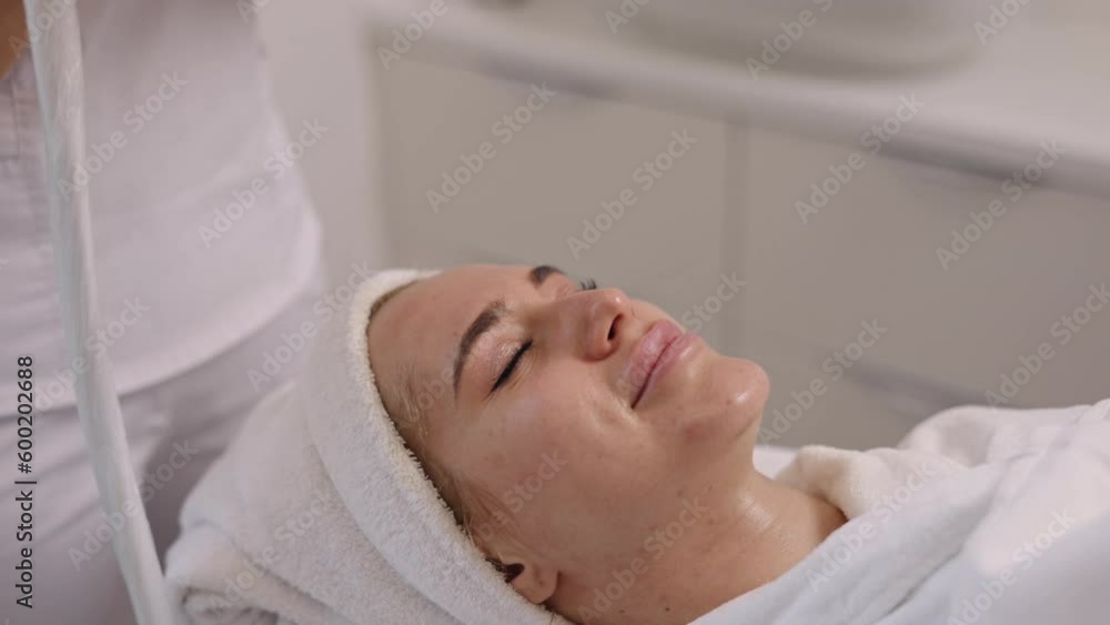 Vacuum lifting, Lifting technique, Skin elevation. Woman skincare specialist conducts vacuum lifting massage for skin rejuvenation and lifting, shown in close detail. Vacuum lifting, Lifting technique, Skin elevation. Woman skincare specialist conducts vacuum lifting massage for skin rejuvenation and lifting, shown in close detail.