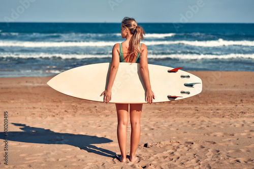 Photography Couple of surfers on the beach