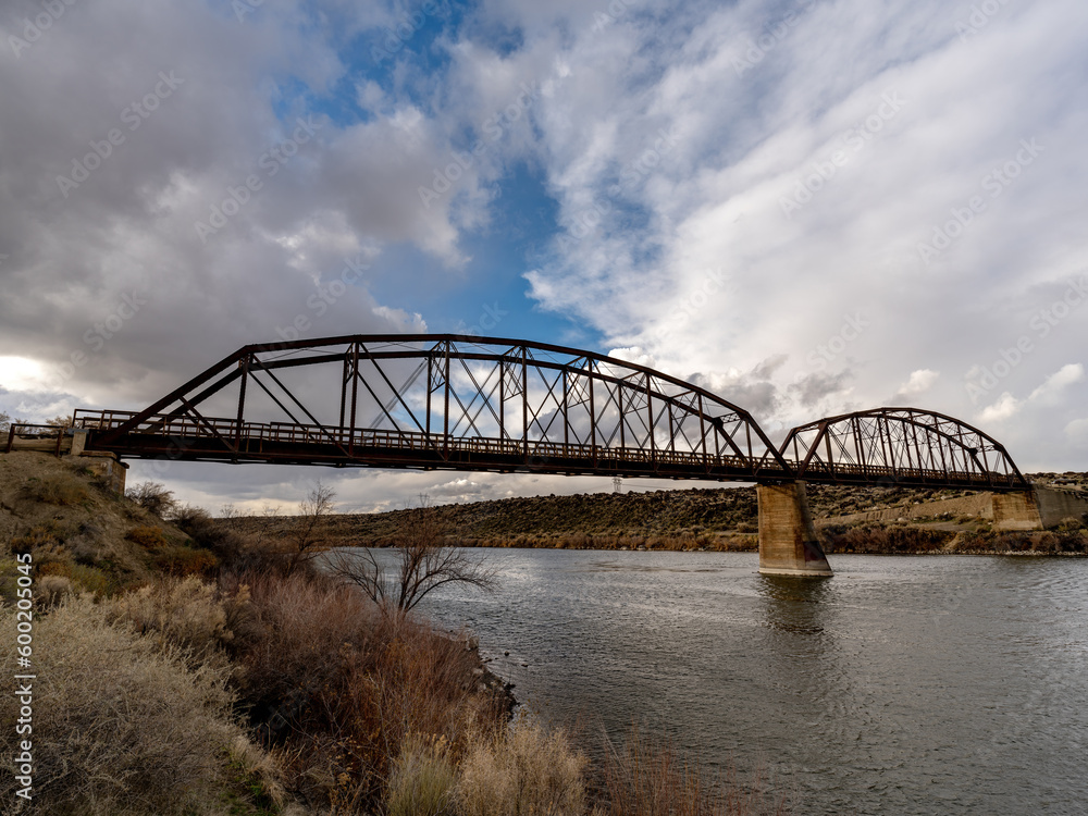Old metal bridge leading over the Snake River in Idaho Old metal bridge leading over the Snake River in Idaho