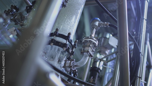 Water pump and pipes. Transparent pipe to show water flows inside the water supply system