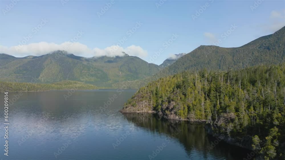 Aerial View of Canadian Mountain Landscape and Lake. Taken in Vancouver Island, British Columbia, Canada. Nature Background. Cinematic Aerial View of Canadian Mountain Landscape and Lake. Taken in Vancouver Island, British Columbia, Canada. Nature Background. Cinematic