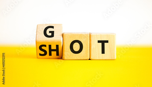 Covid-19 i got vaccine shot medical symbol. Doctor turns wooden cubes and changes with words Got shot. Beautiful yellow table white background. Covid-19 i got booster vaccine shot concept. Copy space