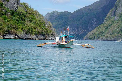 traditional wooden outrigger boats on palawan island
