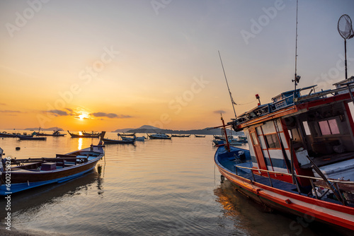 fishing boats at sunrise.Small fishing port in Phuket at sunrise.