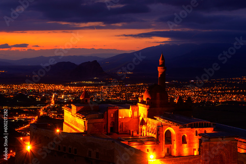 Ishak Pasha Palace (ishakpasa sarayi) near Dogubayazit in Eastern Turkey. Romantic view of this palace, which is the symbol of with evening lights, is touristic, fairy-tale and fascinating at sunset.