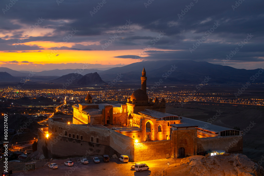 Ishak Pasha Palace (ishakpasa sarayi) near Dogubayazit in Eastern Turkey. Romantic view of this palace, which is the symbol of with evening lights, is touristic, fairy-tale and fascinating at sunset.