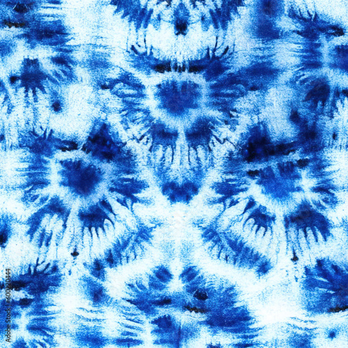 Indigo blue shibori tie dye background. Japanese style batik textile. Variegated for summer fashion swatch. 