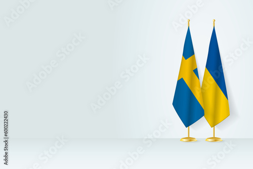 Flags of Sweden and Ukraine on flag stand, meeting between two countries.