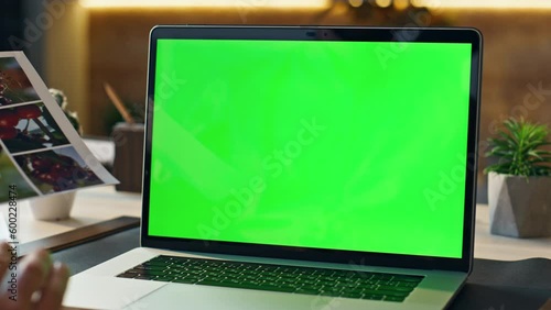 Wallpaper Mural Manager discussing work greenscreen laptop video conference in office close up. Torontodigital.ca