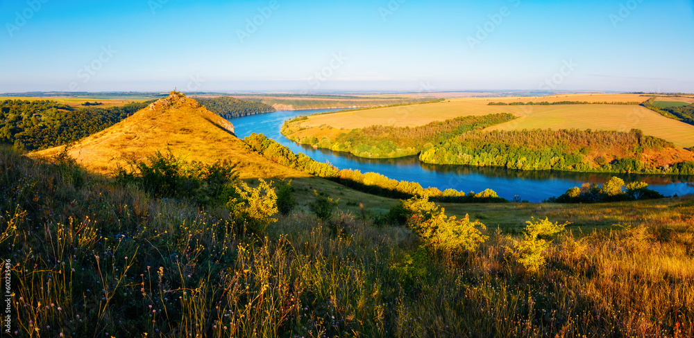 Gorgeous scene with a hilly meadow in sunlight. Dniester canyon national park, Ukraine, Europe.