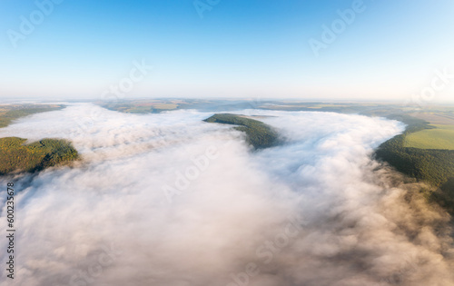 A fantastic bird s-eye view of the valley covered with thick fog.